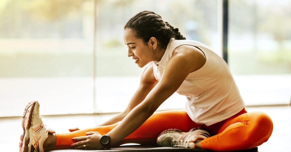 A woman enjoying a yoga stretch indoors, promoting a healthy lifestyle.